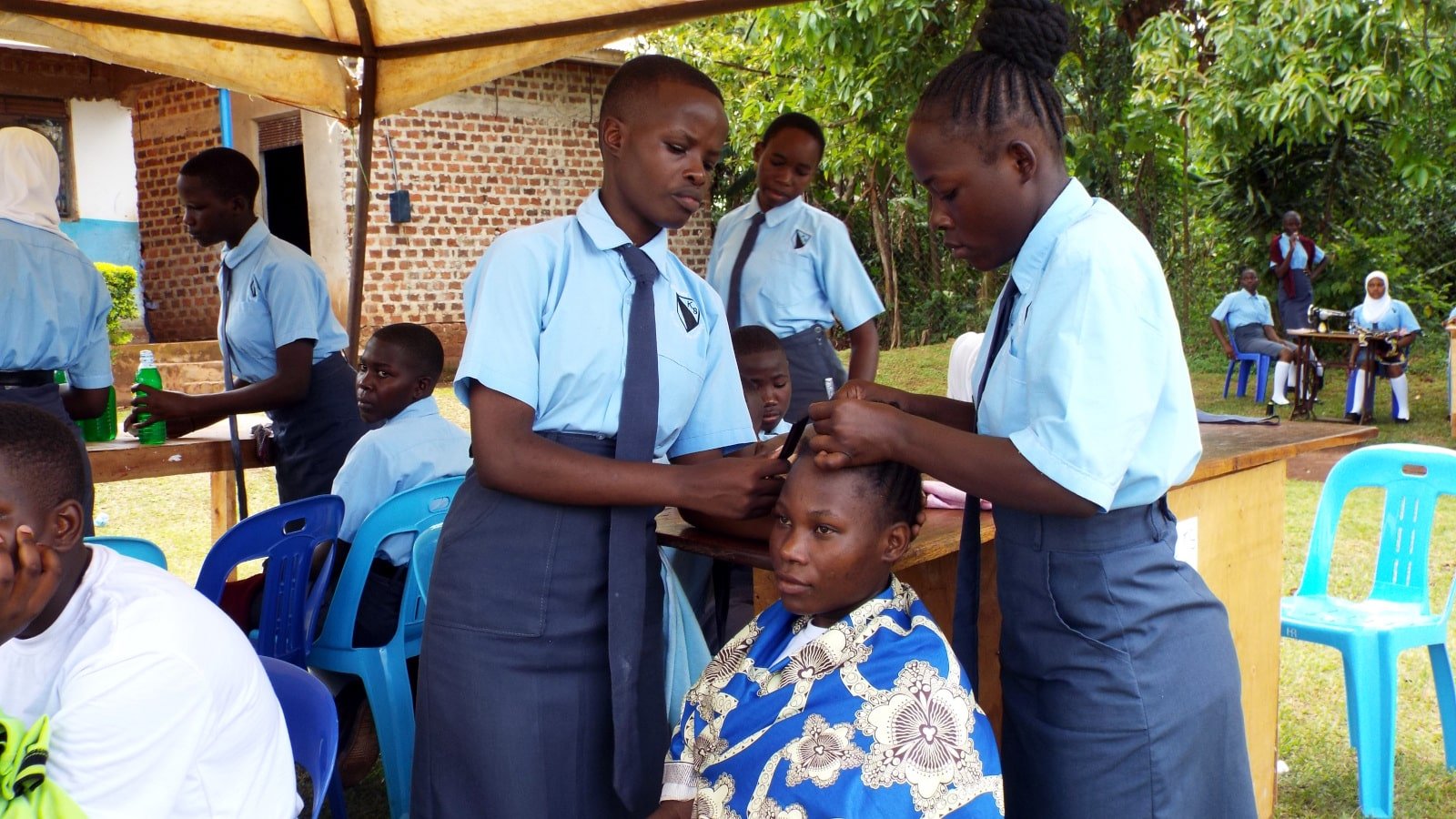 students plaiting hair